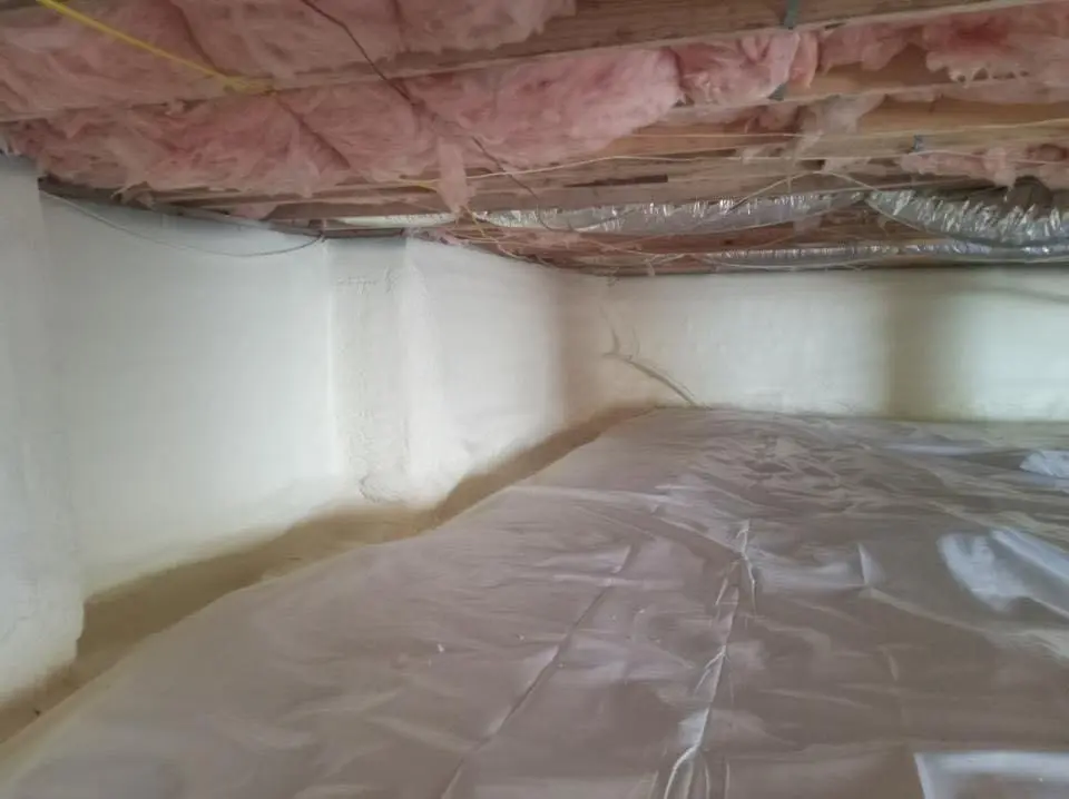 Crawl space encapsulation with closed-cell spray foam for Commercial Roof Restoration in Holly